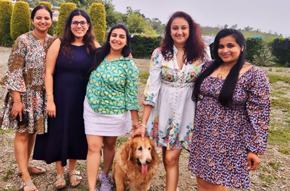 Guests posing for a memorable holiday picture at Monal Meadows villa in Naukuchiatal