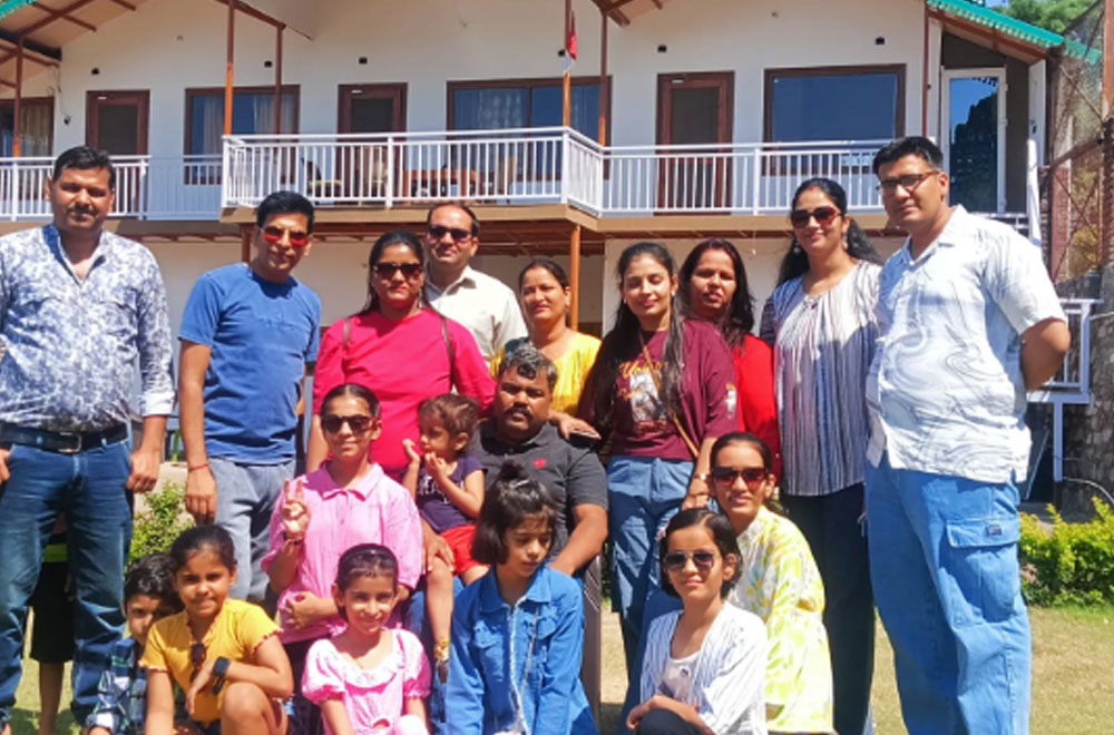 Happy family enjoying their vacation at Monal Meadows homestay in Naukuchiatal